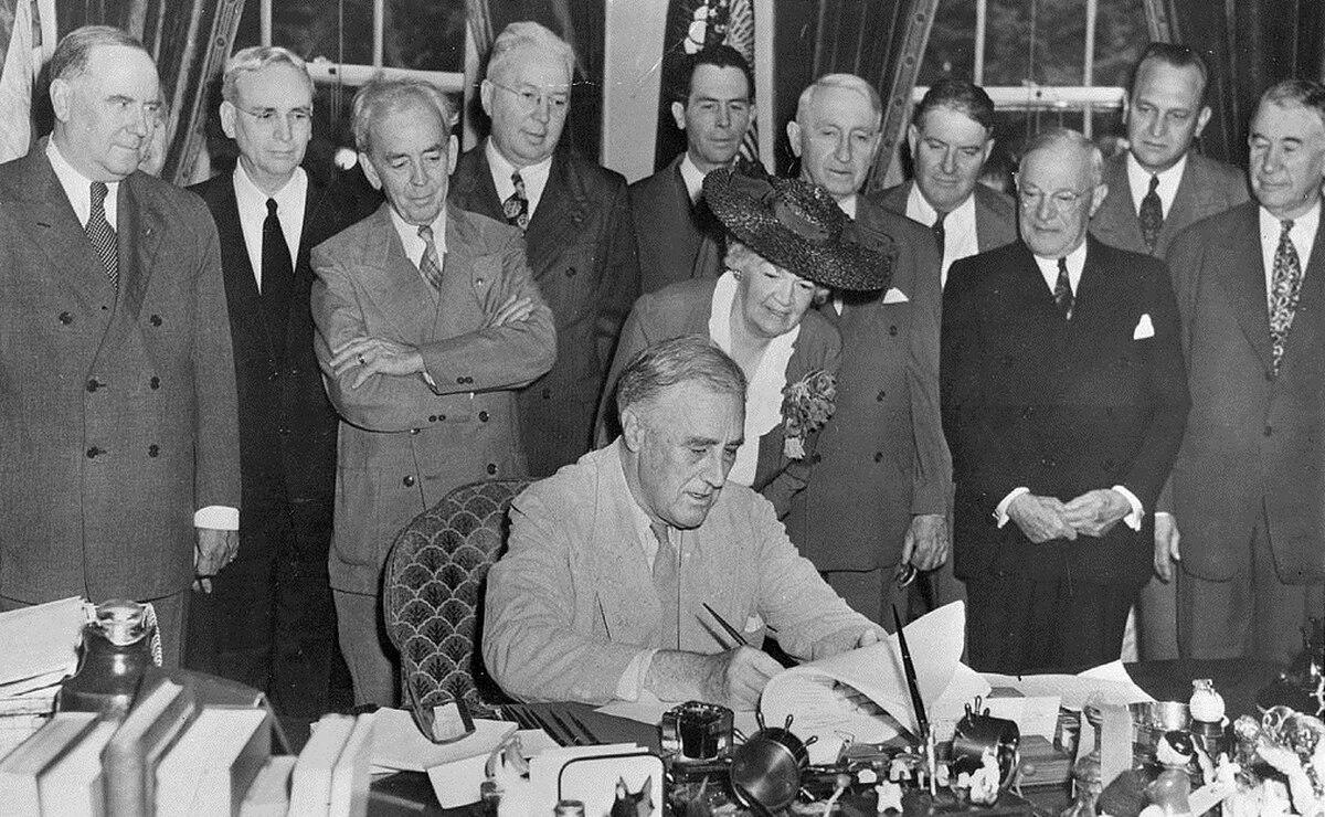 President Franklin Roosevelt signs what would become known as the GI Bill in his office June 22, 1944. (FDR Library Photo Collection)