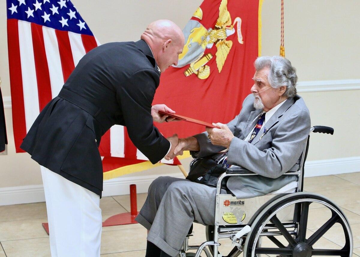 Marine Corps Col. John Polidoro, chief of staff, U.S. Marine Corps Forces Central Command, awards the Silver Star on Cpl. Salvatore Naimo, a Korean War Veteran in Sarasota, Florida, on March 17. (Gunnery Sgt. Eric Alabiso  Nearly 70 years later, Korean War Marine veteran awarded Silver Star on his 89th birthday