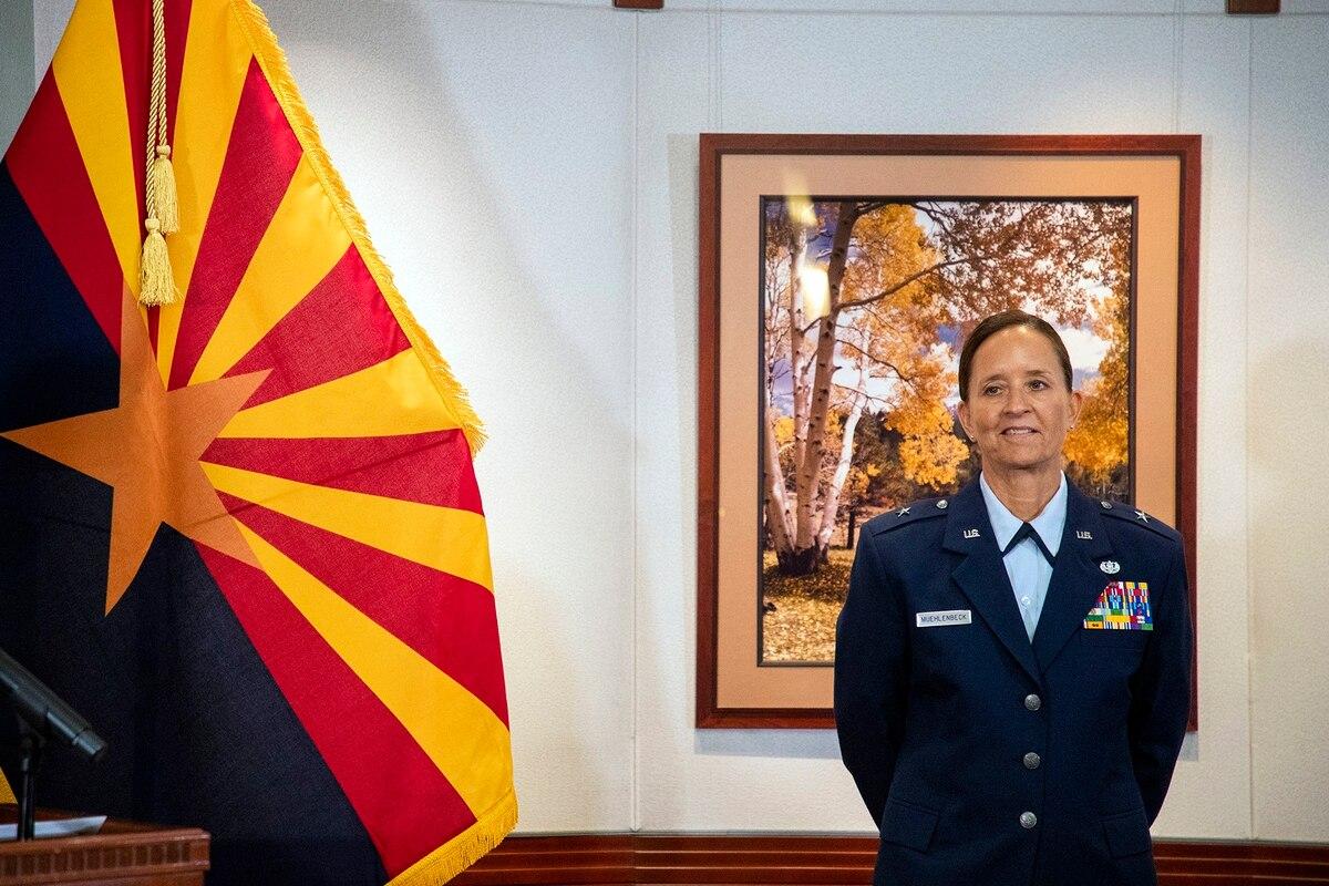Brig. Gen. Kerry L. Muehlenbeck listens as Arizona Gov. Doug Ducey introduces her the state's new adjutant general of the Arizona Guard during a press conference at Arizona State Capitol Executive Tower, Thursday, April 8, Arizona governor appoints first woman to lead stateâ€™s National Guard