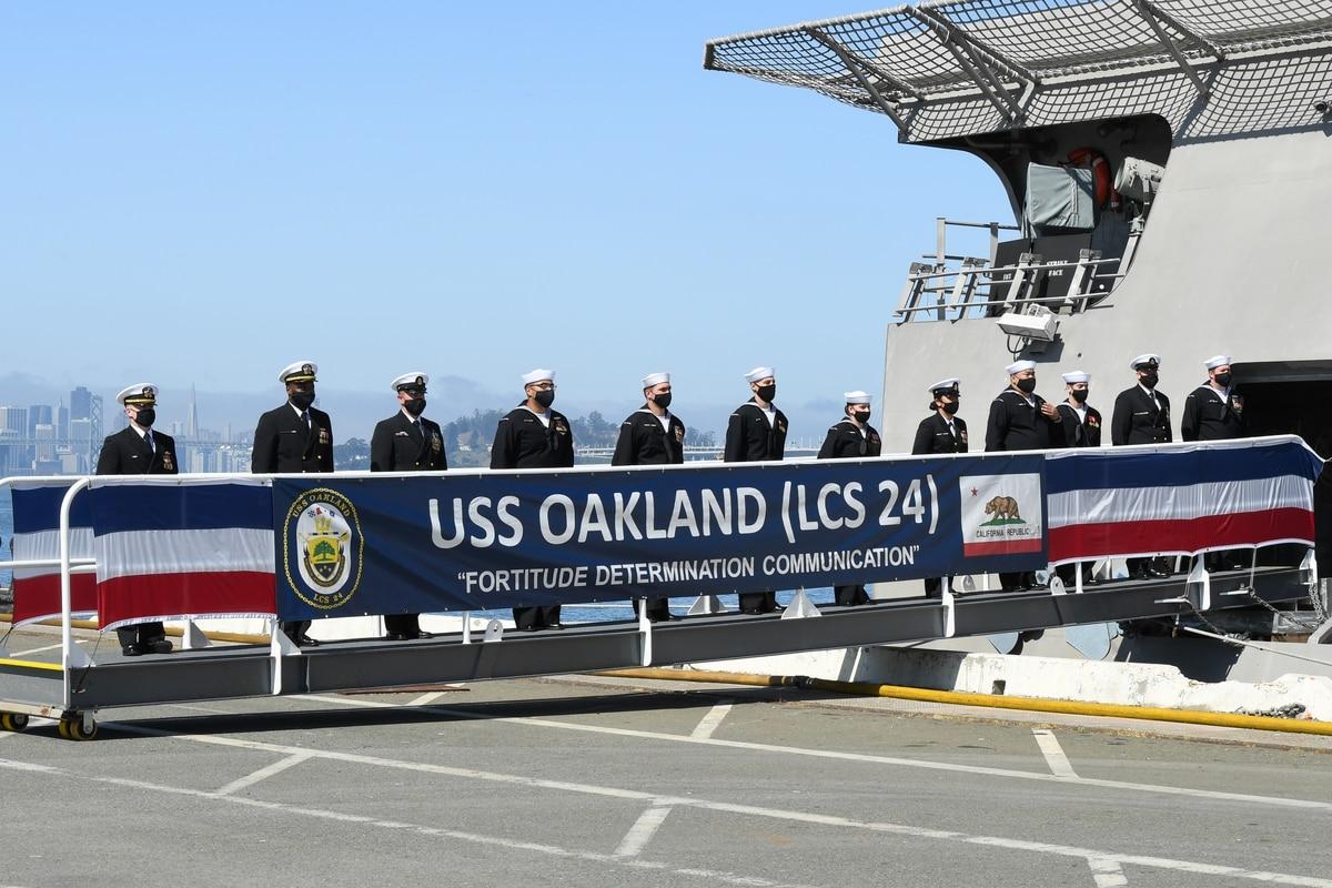 The crew of the littoral combat ship Oakland mans the ship during its commissioning ceremony. (MCC John Pearl/Navy) Navy commissions littoral combat ship Oakland