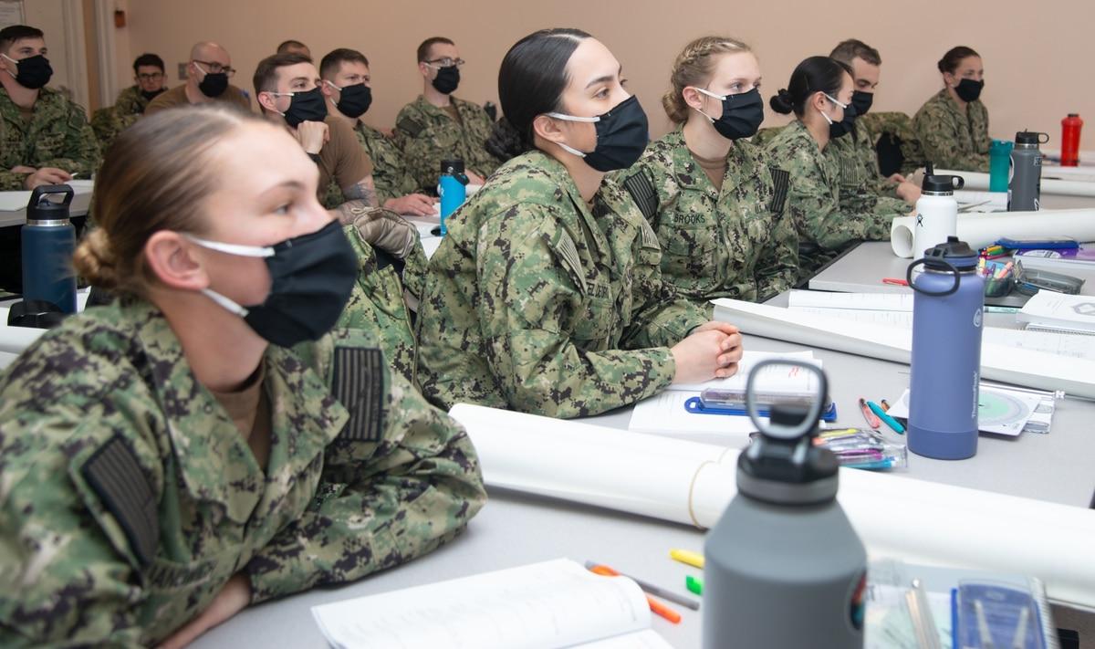 Naval Science Institute Seaman to Admiral-21 students at Officer Training Command Newport, R.I., listen during a class on compasses and navigational equipment. (MC2 Derien Luce/Navy)