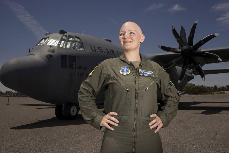 Maj. Sarah Spy, C-130 Hercules pilot for the 152nd Operations Group at the Nevada Air National Guard, poses for a portrait June 2, 2021, at the Signature Flight Support at McCarran International Airport in Las Vegas.(Erik  Nevada Air National Guard has 1st female instructor pilot