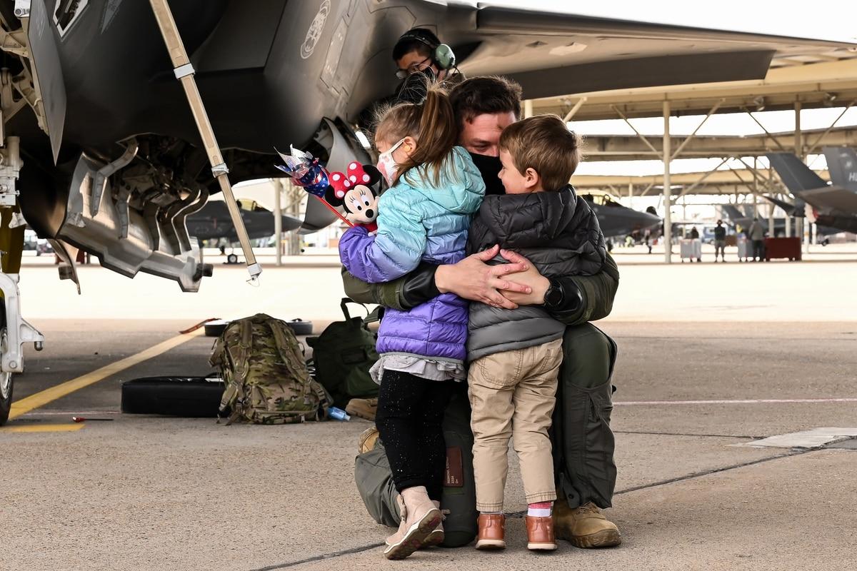 An unidentified F-35A pilot with the 421st Fighter Squadron reunites with his family at Hill Air Force Base, Utah, Oct. 23, 2020, following a six-month deployment to Al Dhafra Air Base, United Arab Emirates. (R. Nial Brads