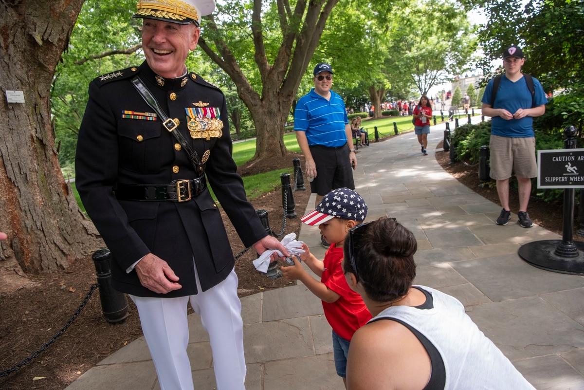 Then-Chairman of the Joint Chiefs of Staff Marine Corps Gen. Joseph F. Dunford, Jr. greets a young visitor at the 151st Memorial Day Observance at Arlington National Cemetery, Arlington, Virginia, May 27, 2019. (Lisa Ferdi Massachusetts town to name street after retired Marine general