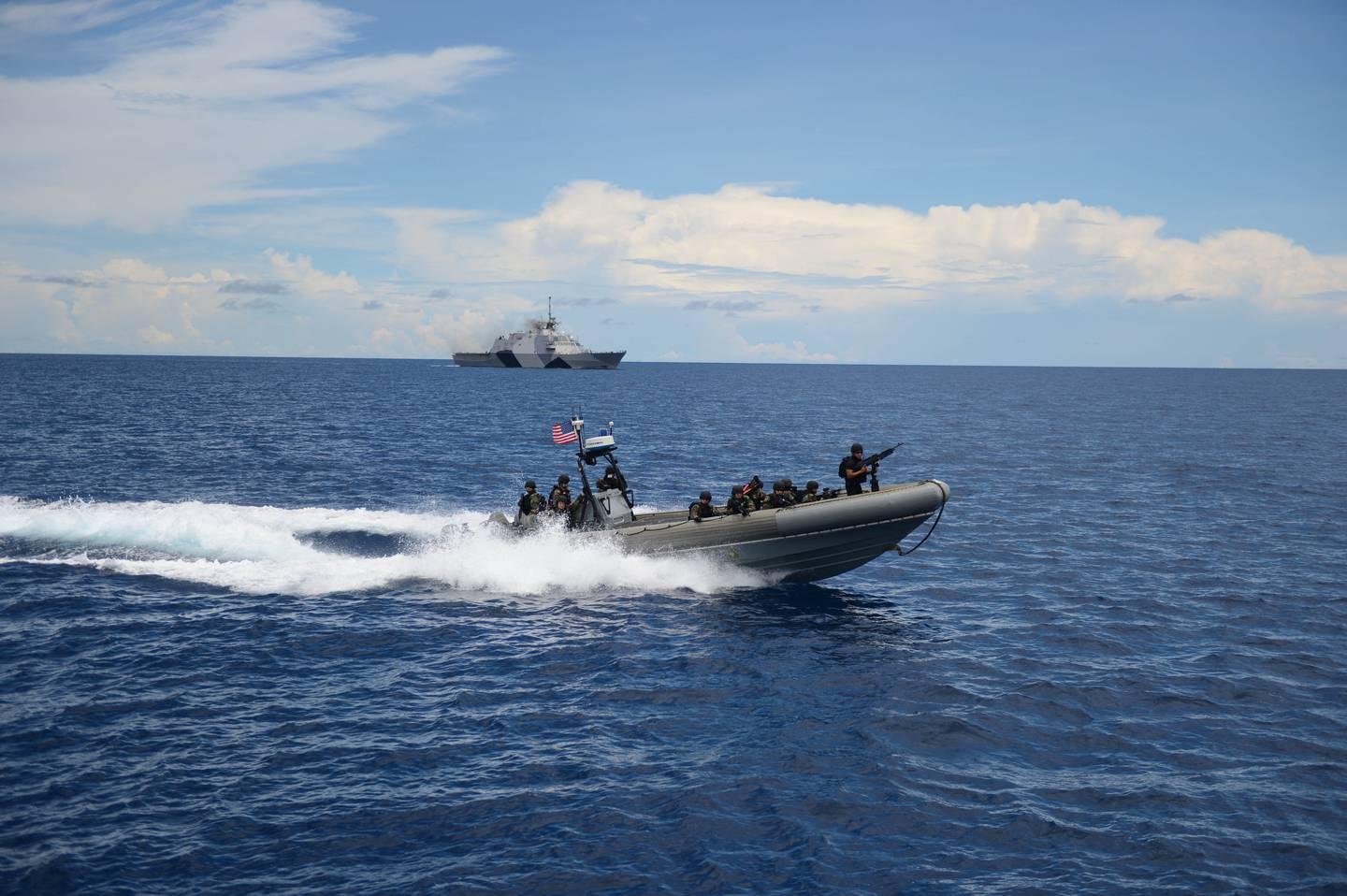 Sailors with the littoral combat ship Freedom prepare to board a Brunei navy ship during a compliant boarding exercise as part of Southeast Asia Cooperation and Training in 2013. (MC3 Karolina Oseguera/Navy) (U.S. Navy) Navy, partner nations launch SEACAT exercise in Singapore