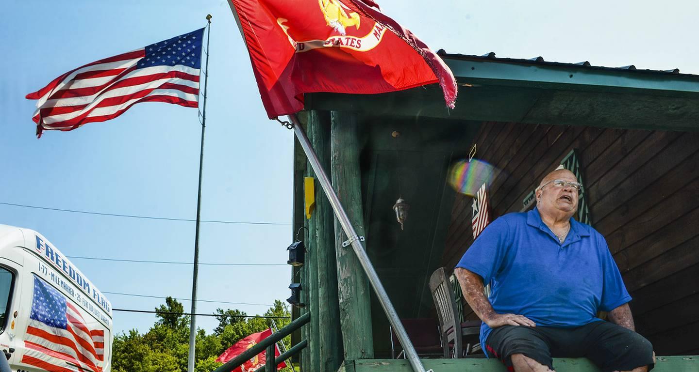 This July 7, 2021, photo shows retired Master Sgt. Dayton C. Meadows III at his MercerCounty property in Ghent, West Virginia. (Kenny Kemp/Charleston Gazette-Mail via AP) (AP) Retired Marine displays giant American flag in West Virginia