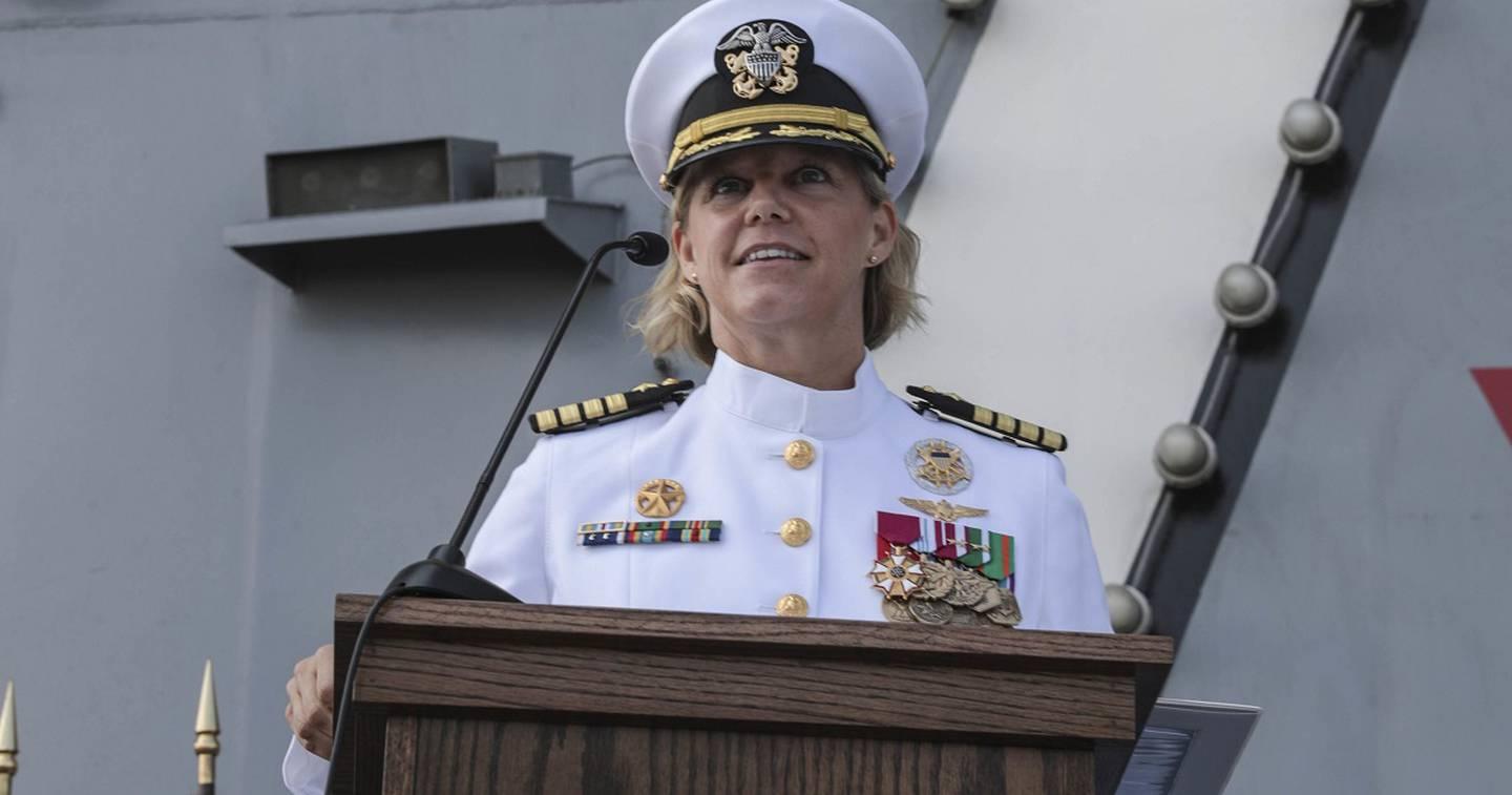 Capt. Amy Bauernschmidt, newly appointed commanding officer of the aircraft carrier Abraham Lincoln, delivers remarks during a change of command ceremony on the flight deck. (MC3 Jeremiah Bartelt/Navy) (USS Abraham Lincoln