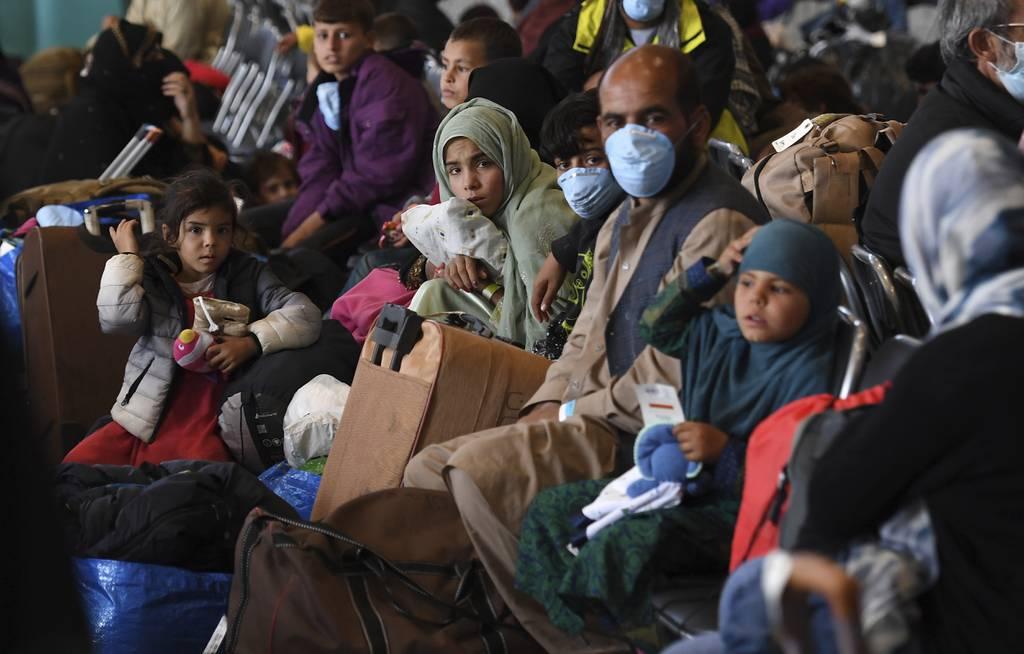 Afghan refugees are processed inside Hangar 5 at the Ramstein U.S. Air Base in Germany Wednesday, Sept. 8, 2021. U.S. Secretary of State Antony Blinken arrived at the base where he will meet with his German counterpart for U.S. Defense, State officials will meet with rescue groups to help evacuate Americans, Afghan allies