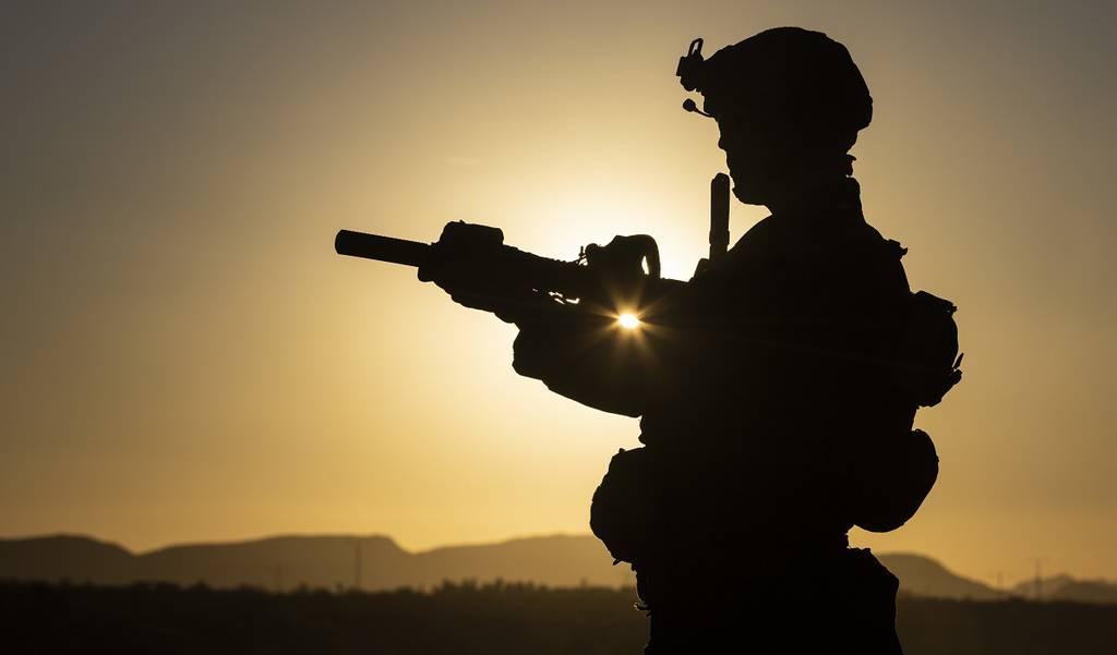 A Marine Raider with Marine Forces Special Operations Command aims his rifle in support of a vehicle interdiction exercise during Weapons and Tactics Instructor (WTI) course 1-20 at K9 Village in Yuma Proving Ground, Arizo