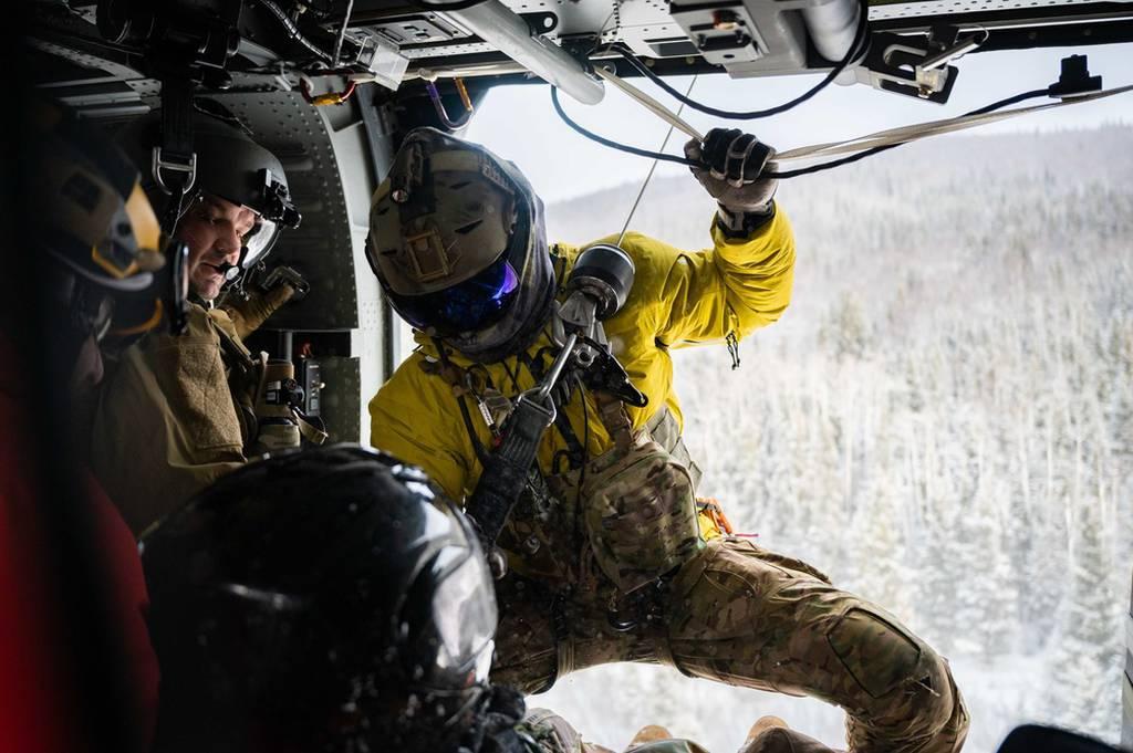 Airmen assigned to the 210th and 212th Rescue Squadrons participate in a rescue exercise near Eielson Air Force Base, Alaska, March 26, 2021. The 212th RQS provides elite pararescuemen, combat rescue officers and Survival, A snowstorm and a plane crash stranded 13 in the Alaskan wilderness. The Guardsmen who rescued them have won an award.