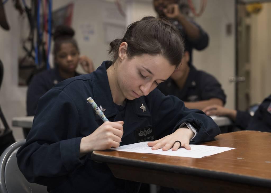 Operations Specialist 2nd Class Michelle Sanchez participates in an instructor-led Navy College Program for Afloat College Education class on board the dock landing ship Oak Hill. (MC3 Jessica L. Dowell/Navy) Naval Community College prepares for second influx of sailors, Marines and Coast Guardsmen