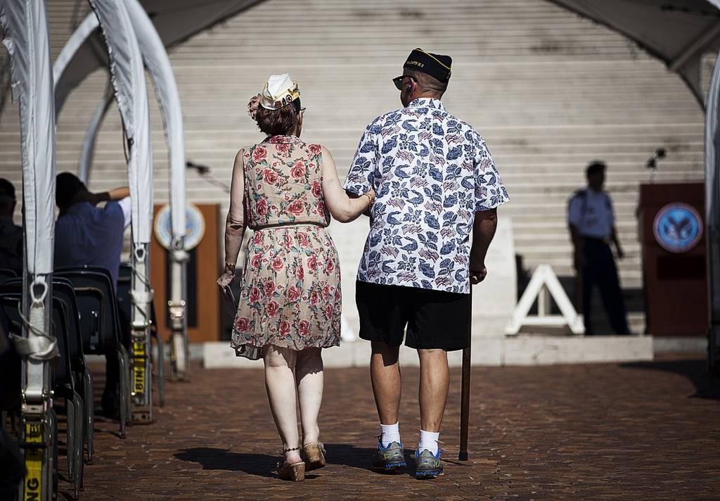 Army veterans walk to their seats before a National Prisoner of War and Missing in Action Recognition Day ceremony in Honolulu on Sept. 21, 2012. (Cpl. Reece Lodde/Marine Corps) VA Secretary pledges improved support for caregivers