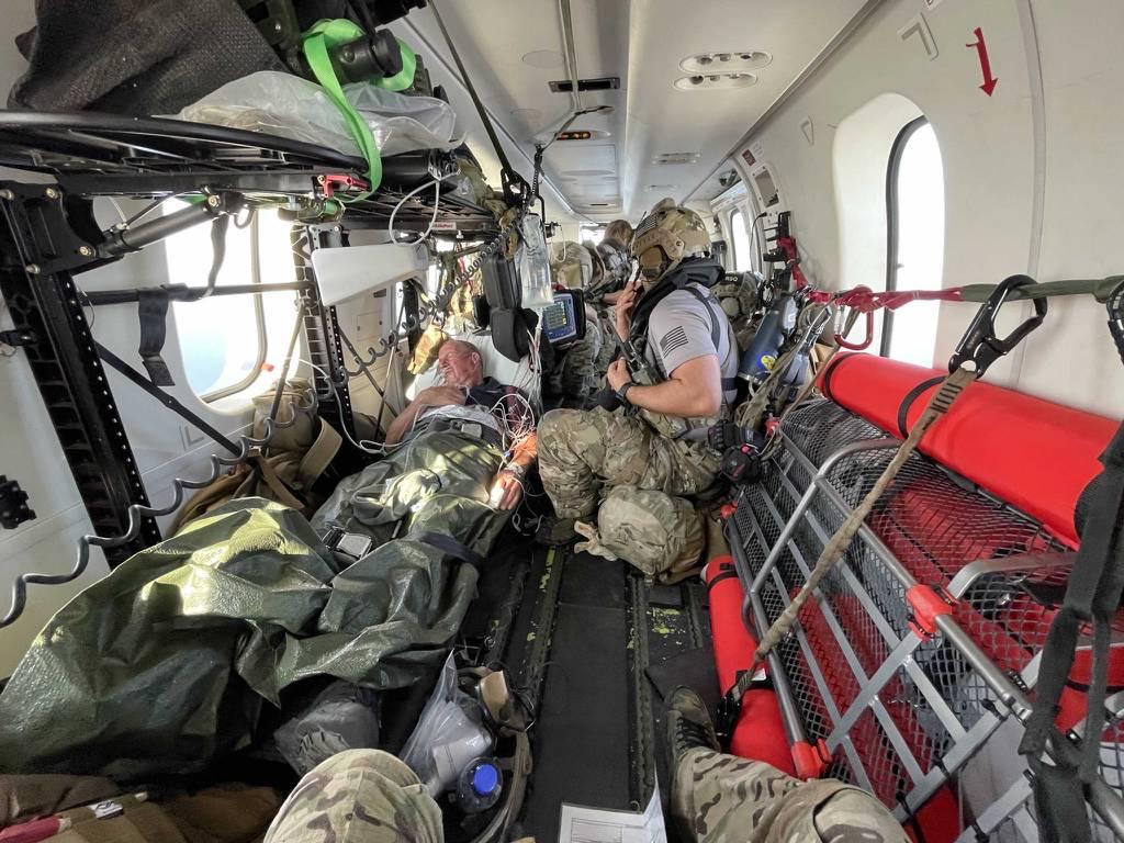 U.S. Air Force PJs treat U.K. mariner Kevin Nixon on board a DHC-8 airplane during a complex two-day medical evacuation from the Indian Ocean, Nov. 13-14, 2021. (AFRICOM)