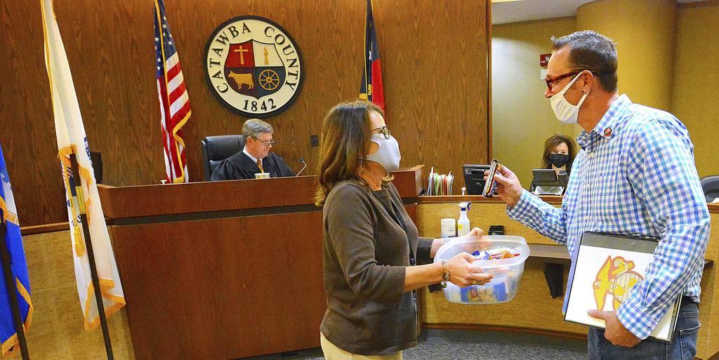 Veteran Court organizer Tammy West offers Marine veteran Tommy Todd, 47, to select a treat after receiving his certificate of completion for the first phase of Catawba County Veterans Court, on Oct. 28, 2021, in Catawba Co New treatment court gives N.C. veterans a second chance