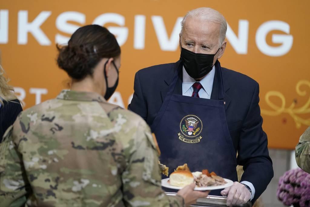 President Joe Biden serves dinner during a visit to soldiers at Fort Bragg to mark the upcoming Thanksgiving holiday, Monday, Nov. 22, 2021, in Fort Bragg, N.C. (Evan Vucci/AP)