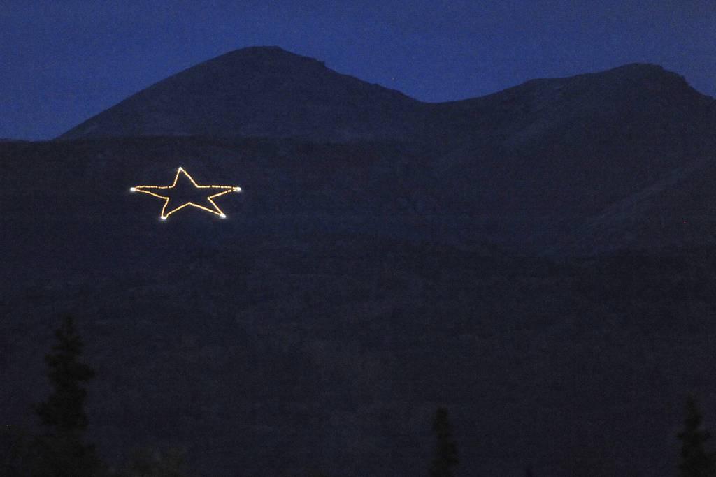 The Joint Base Elmendorf-Richardson star is Illuminated on the side of Mount Gordon Lyon on Wednesday, Sept. 11, 2019, just east of Anchorage, Alaska, in observation of the 18th anniversary of the terrorist attacks. (Bill 