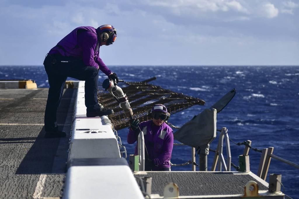 Aviation Boatswainâ€™s Mate (Fuel) 3rd Class Logan Carlson, right, passes a fueling hose to Aviation Boatswainâ€™s Mate (Fuel) 1st Class Leonard Zaborowski on the flight deck of the amphibious transport dock ship San Diego Navy unveils new enlisted career policy designed to encourage sailors to remain at sea