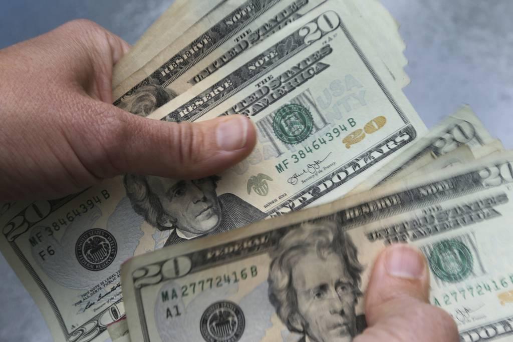 A bipartisan group of 14 lawmakers is urging House appropriators to consider setting a $15 minimum wage for all troops