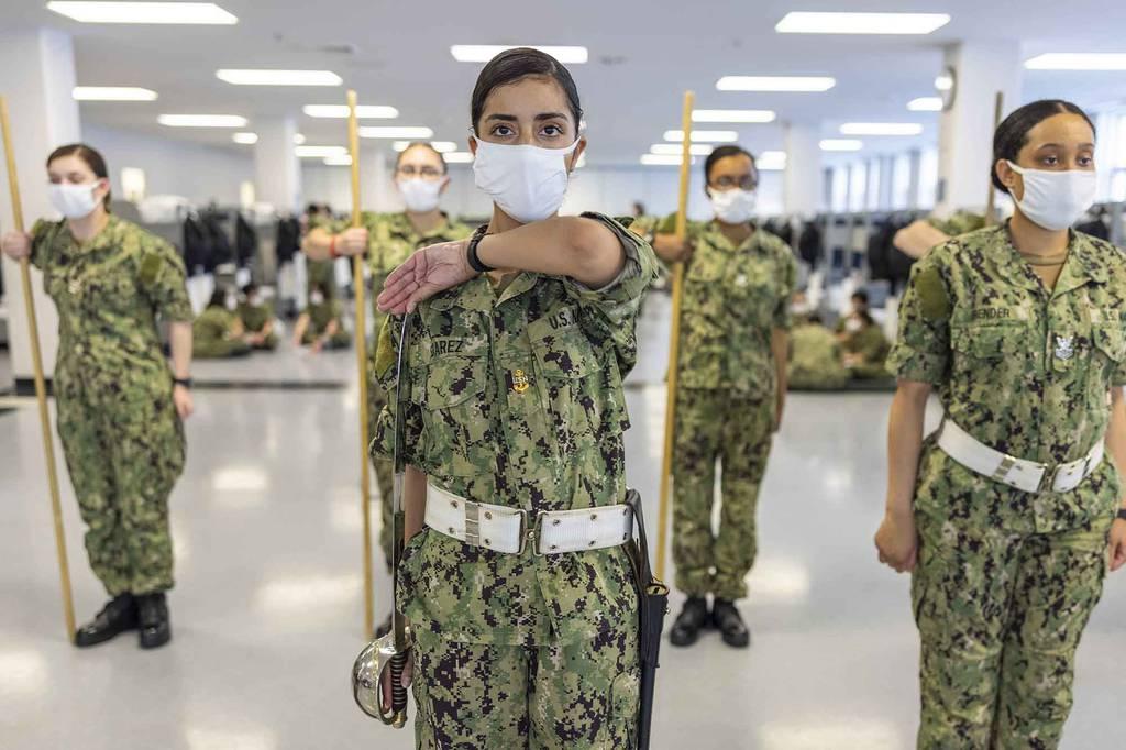 A recruit chief petty officer transitions to parade rest during drill practice inside a compartment of the USS Enterprise recruit barracks at Recruit Training Command, Great Lakes, Ill. (MC1 Camilo Fernan/Navy) New in 2022: Navy to lengthen Basic Military Training; expand its community college