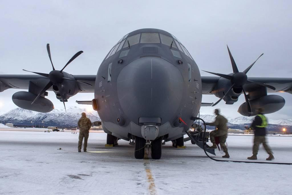 Airmen assigned to the 176th Maintenance Squadron, Alaska Air National Guard, check a HC-130J Combat King II prior to takeoff at Joint Base Elmendorf-Richardson, Alaska, Jan. 21, 2021. (Airman 1st Class Emily Farnsworth/Ai