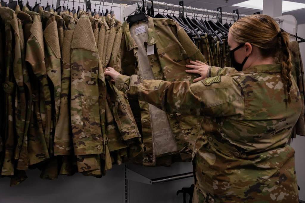 Senior Airman Quynn Santjer, unit deployment manager for the 94th Fighter Squadron, looks through the new abundance of maternity options at Joint Base Langley-Eustis, Virginia, Dec. 2, 2021. (Staff Sgt. Jaylen Molden/Air F