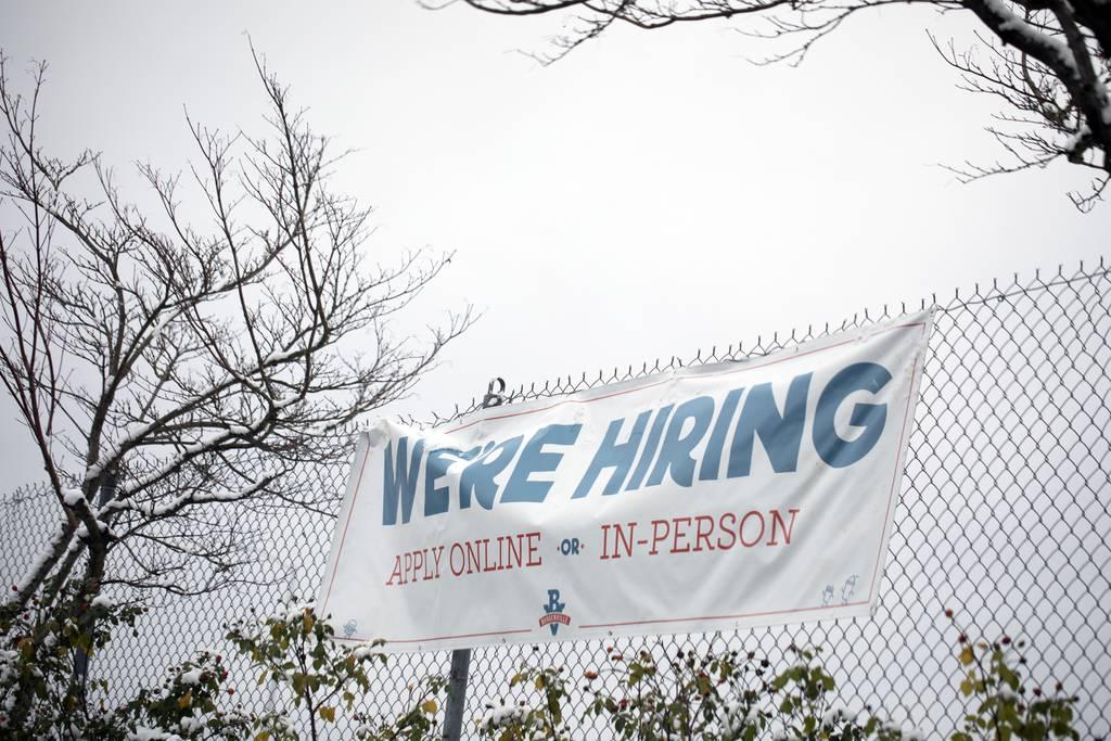Thumbnail: A sign seeking workers is displayed at a fast food restaurant in Portland, Ore., on Dec. 27, 2021. (Jenny Kane/AP)
