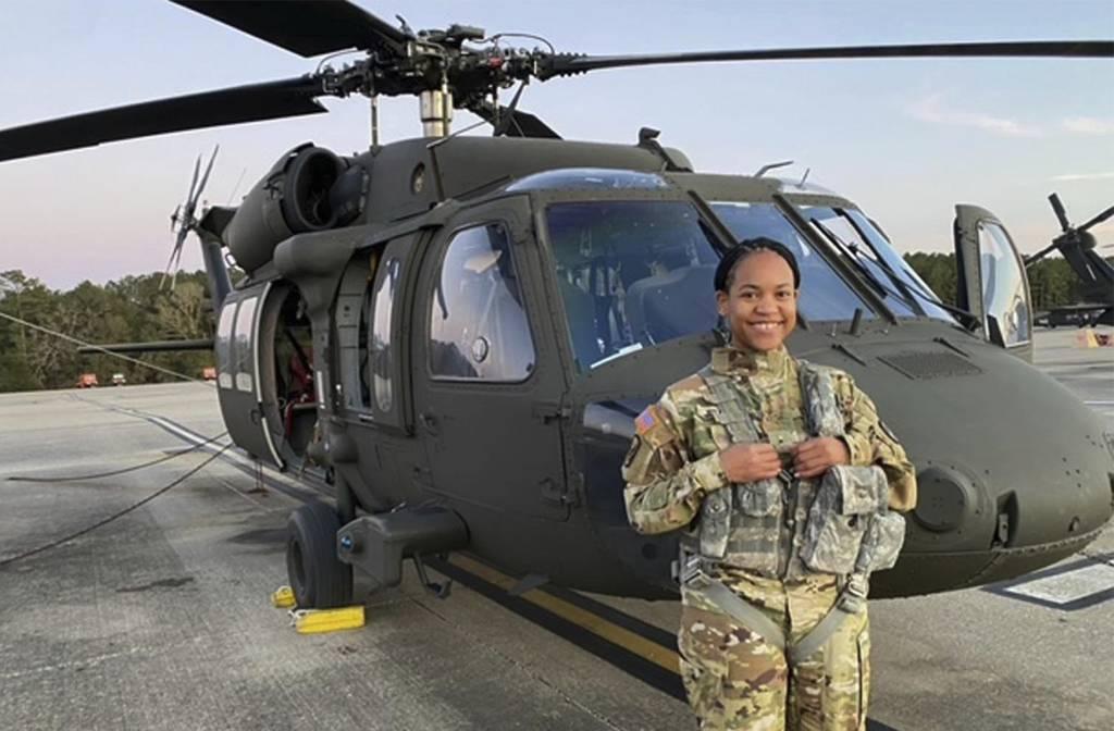 This undated photo provided by Louisiana National Guard shows Louisiana Army National Guard Warrant Officer Tatiana Julien in front of her National Guard helicopter. (Louisiana National Guard via AP) Meet the Louisiana Army National Guardâ€™s first Black woman pilot