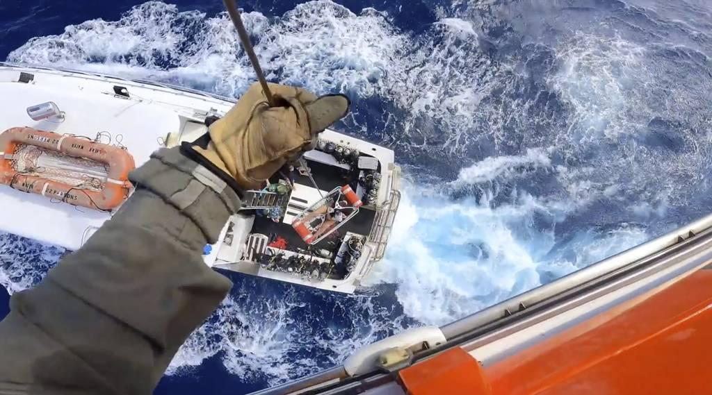 A Coast Guard Air Station Miami MH-65 Dolphin helicopter crew rescues a man after he was bitten by a shark while fishing aboard a vessel near Bimini, Bahamas, on Monday, Feb. 21, 2022. (Coast Guard via AP) Coast Guard rescues fisherman bitten by shark near Bimini
