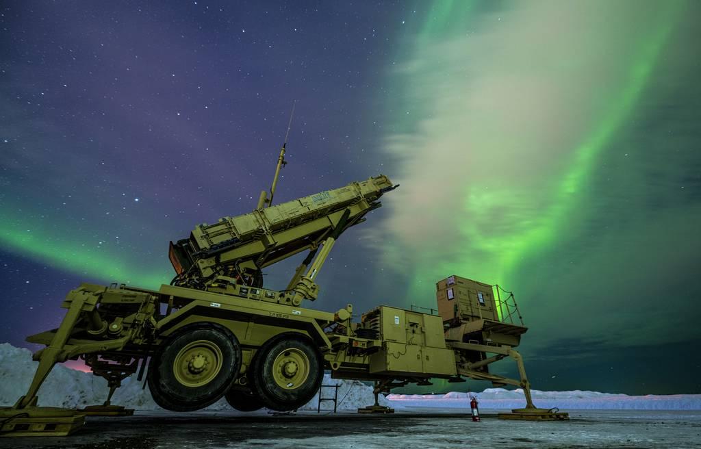 The northern lights glow behind a Patriot M903 launcher station assigned to 5th Battalion, 52nd Air Defense Artillery Regiment, during Exercise ARCTIC EDGE 2022 at Eielson Air Force Base, Alaska. (Senior Airman Joseph P. L Soldiers integrate air defense for the first time in major Alaska exercise