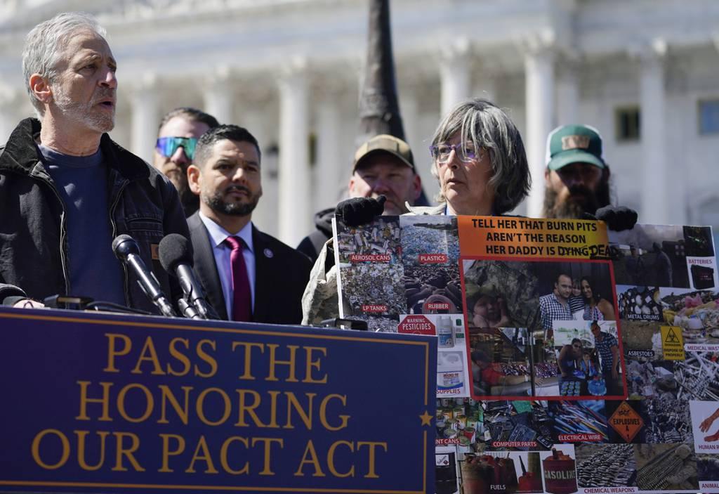 Entertainer Jon Stewart (left) speaks at a press conference on legislation to benefit burn pit victims while surrounded by lawmakers and other activists outside the Capitol building on March 29. (Mariam Zuhaib/AP) Senate leaders promise vote on expanding benefits for burn pit victims