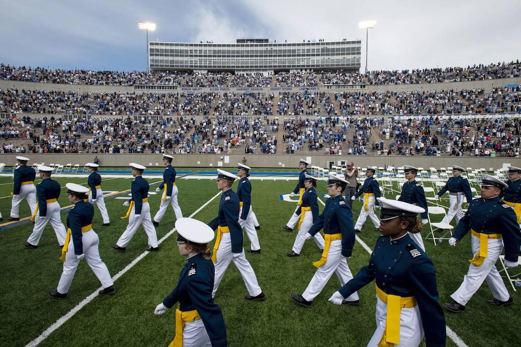 FILE - Air Force Academy cadets make their way to their seats as family and friends cheer from the stands during the United States Air Force Academy's Class of 2021 graduation ceremony at the USAFA in Colorado Springs, Col 4 Air Force cadets may not graduate due to vaccine refusal