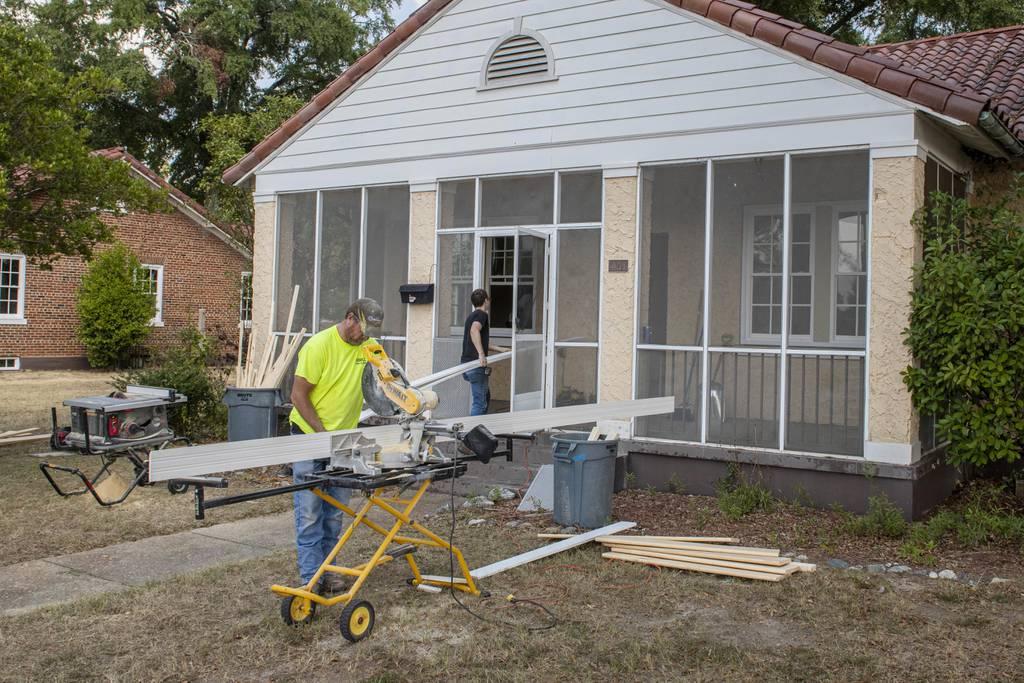 Workers install new windows and siding at a home on Fort Benning, Georgia, Oct. 1, 2019. (Patrick A. Albright/Army) VA reaching out to veterans, builders in effort to award more adapted housing grants