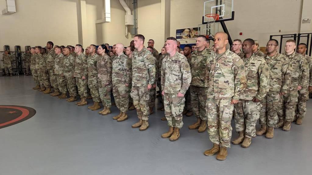 New York Army National Guard soldiers from the 27th Infantry Brigade Combat Team, who are deploying to Germany as part of the Joint Multinational Training Group-Ukraine, stand at attention during a farewell ceremony at the