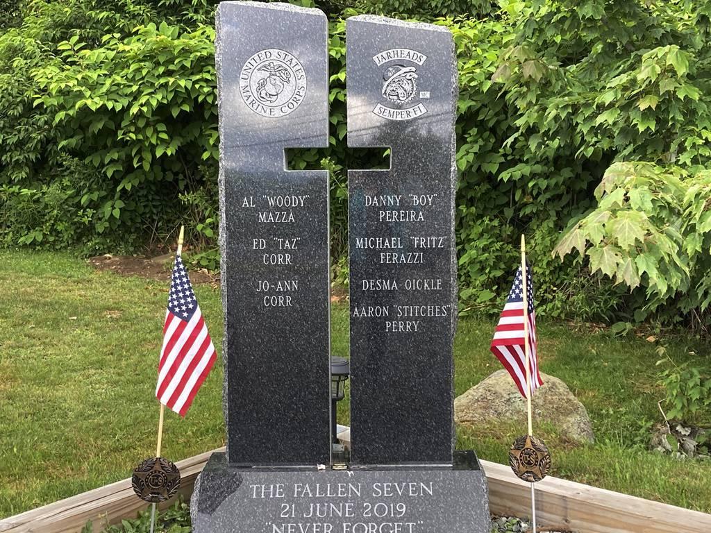 Victim names are listed on two stone pillars, part of a memorial to honor members of the Jarheads Motorcycle Club killed in a nearby crash, are visible July 13, 2022, on the roadside in Randolph, New Hampshire. (Kathy McCo