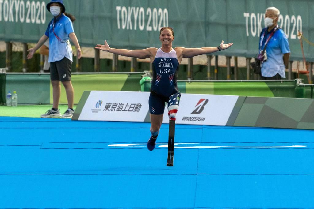 Melissa Stockwell reacts arriving at the finish line in the Women