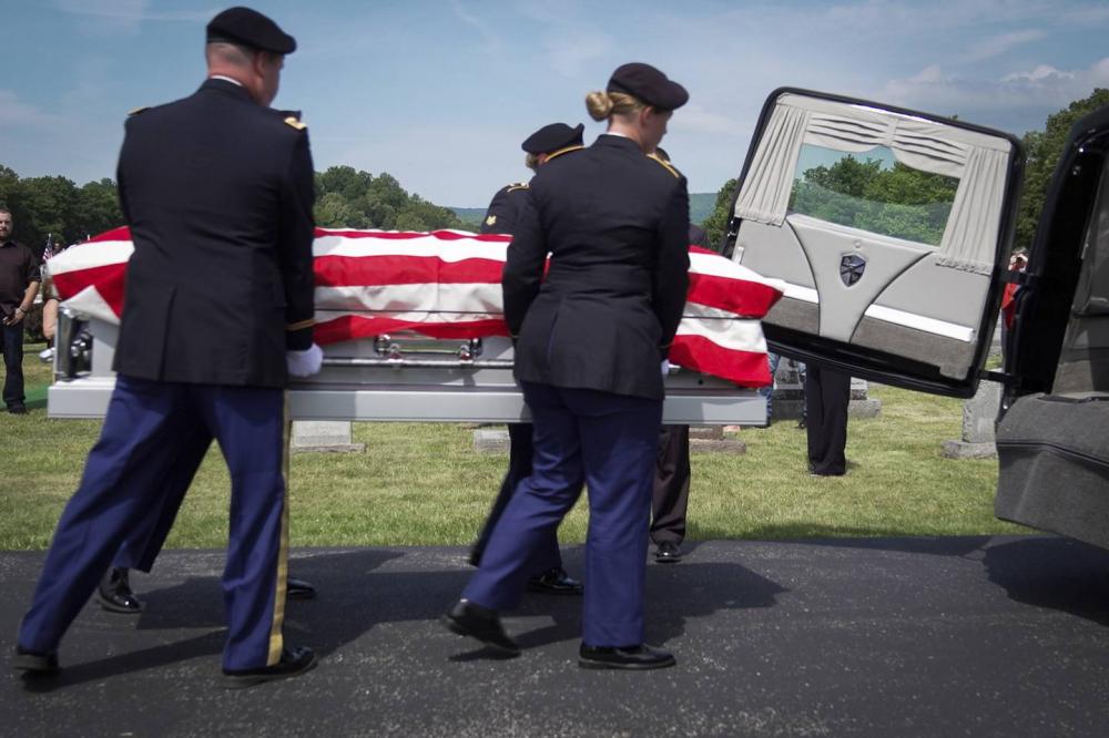 Enlarge The casket of Cpl. Paul Wilkins is removed from the hearse at Logan Valley Cemetery, Sa... 